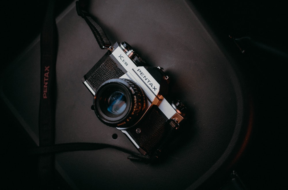 an old camera sitting on top of a table