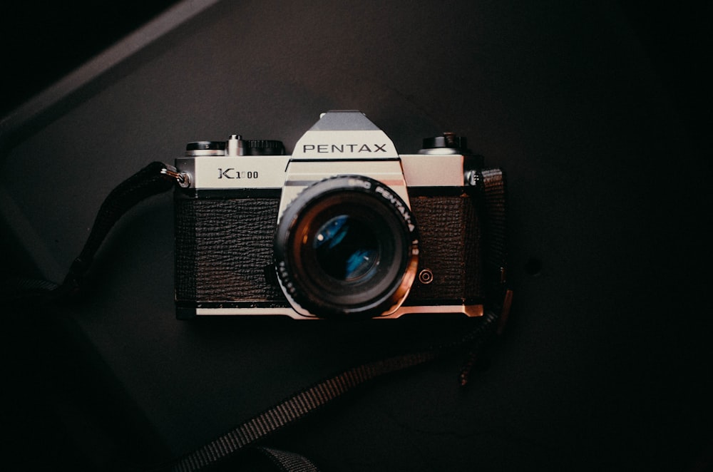 an old camera sitting on top of a table