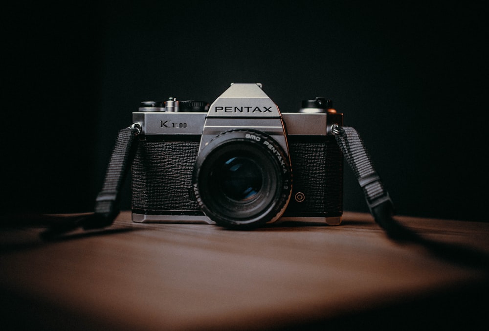 a camera sitting on top of a wooden table