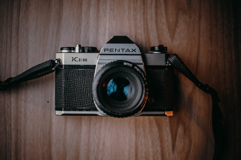 a camera sitting on top of a wooden table