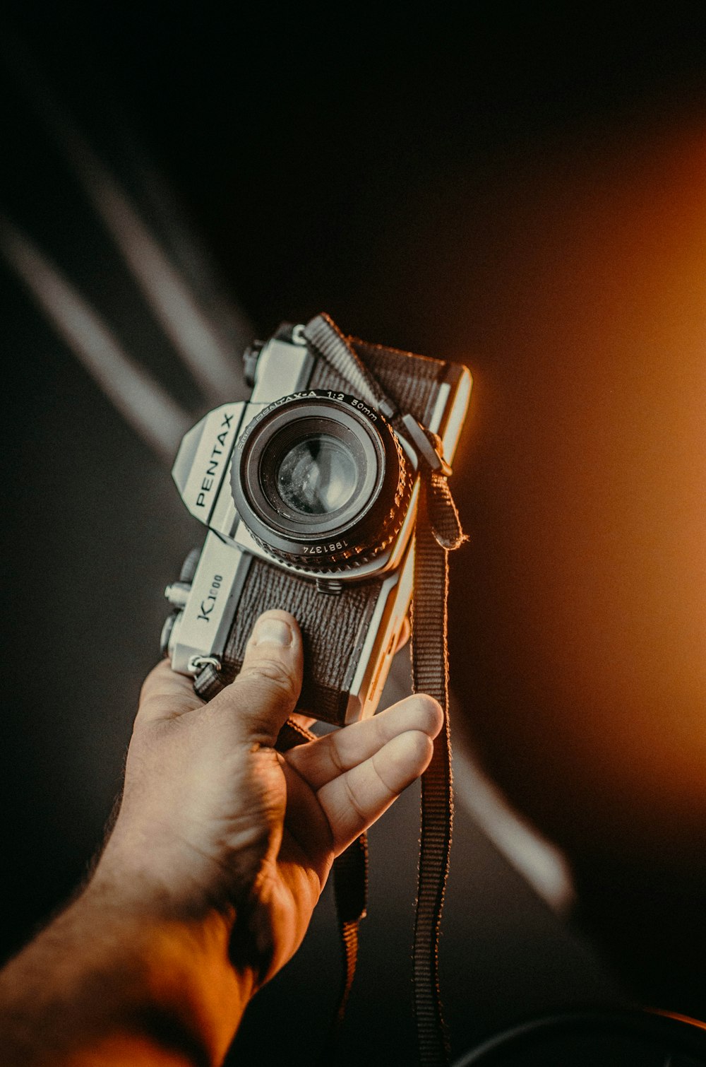 a person holding a camera in their hand