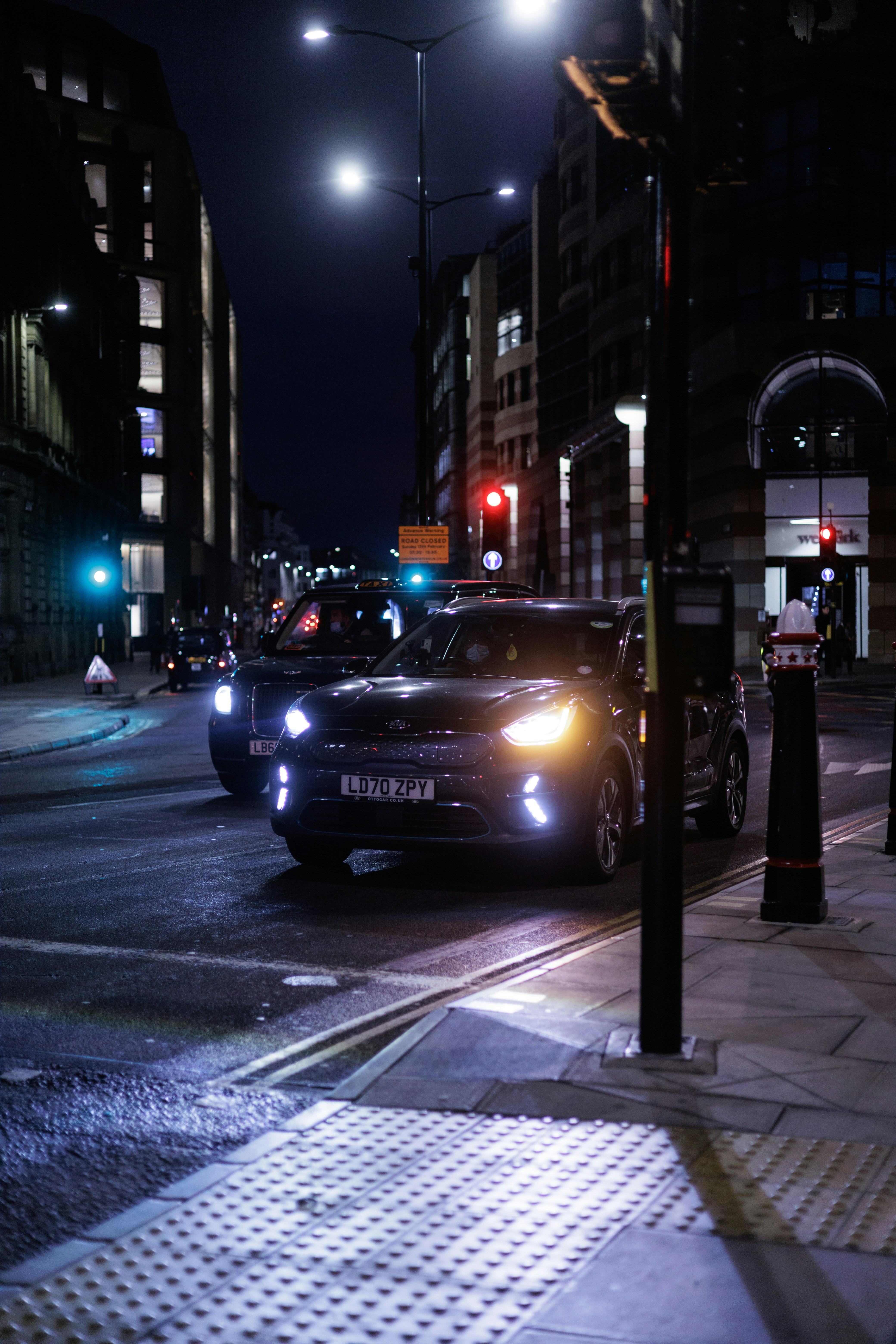 A couple of cars that are sitting in the street photo – Free Cheapside ...