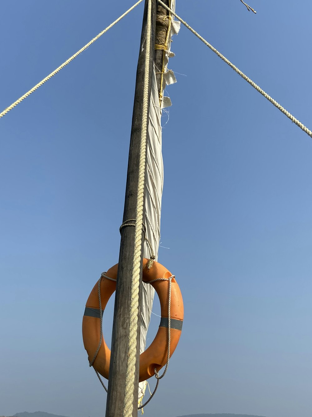 a life preserver hanging on the side of a pole
