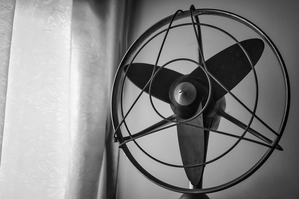 a black and white photo of a fan