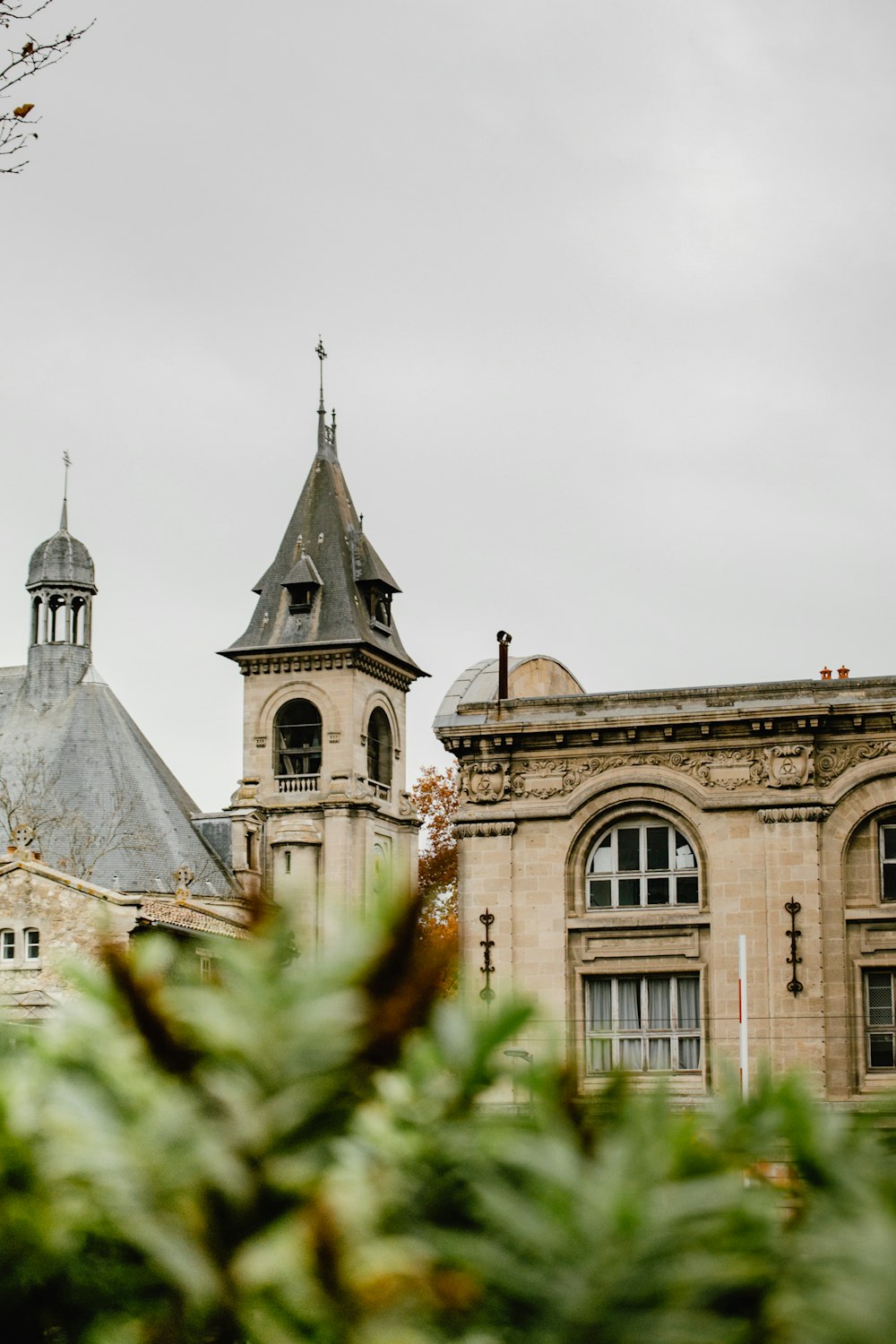 a building with two towers and a clock tower