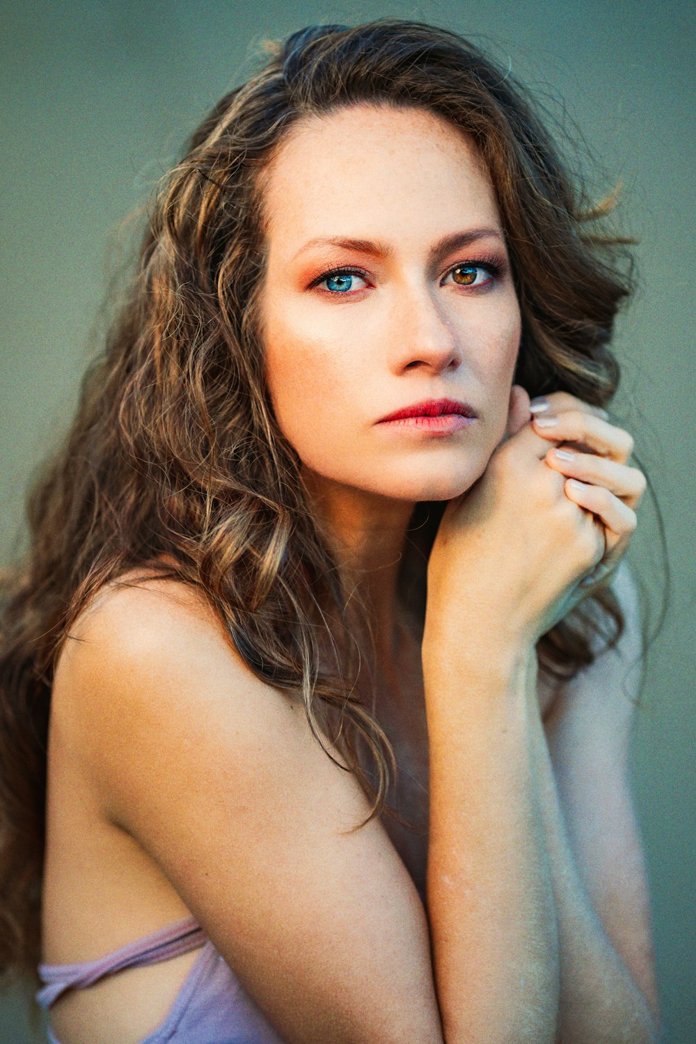 a woman with long hair posing for a picture