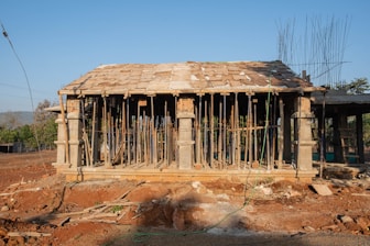 a small building with a lot of sticks sticking out of it