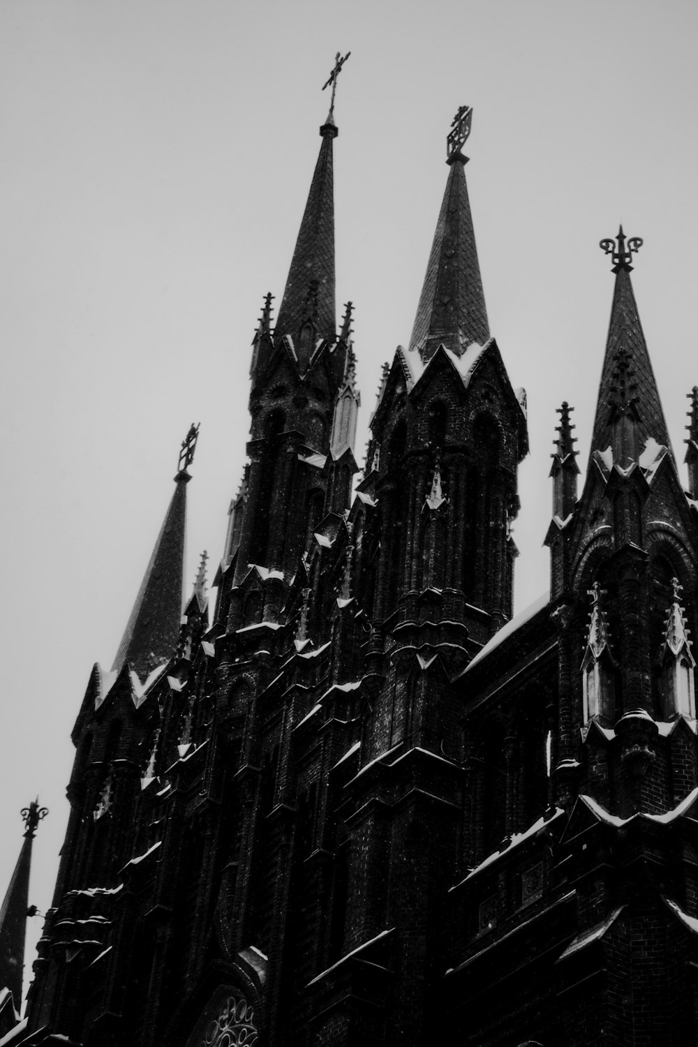 a black and white photo of a gothic church