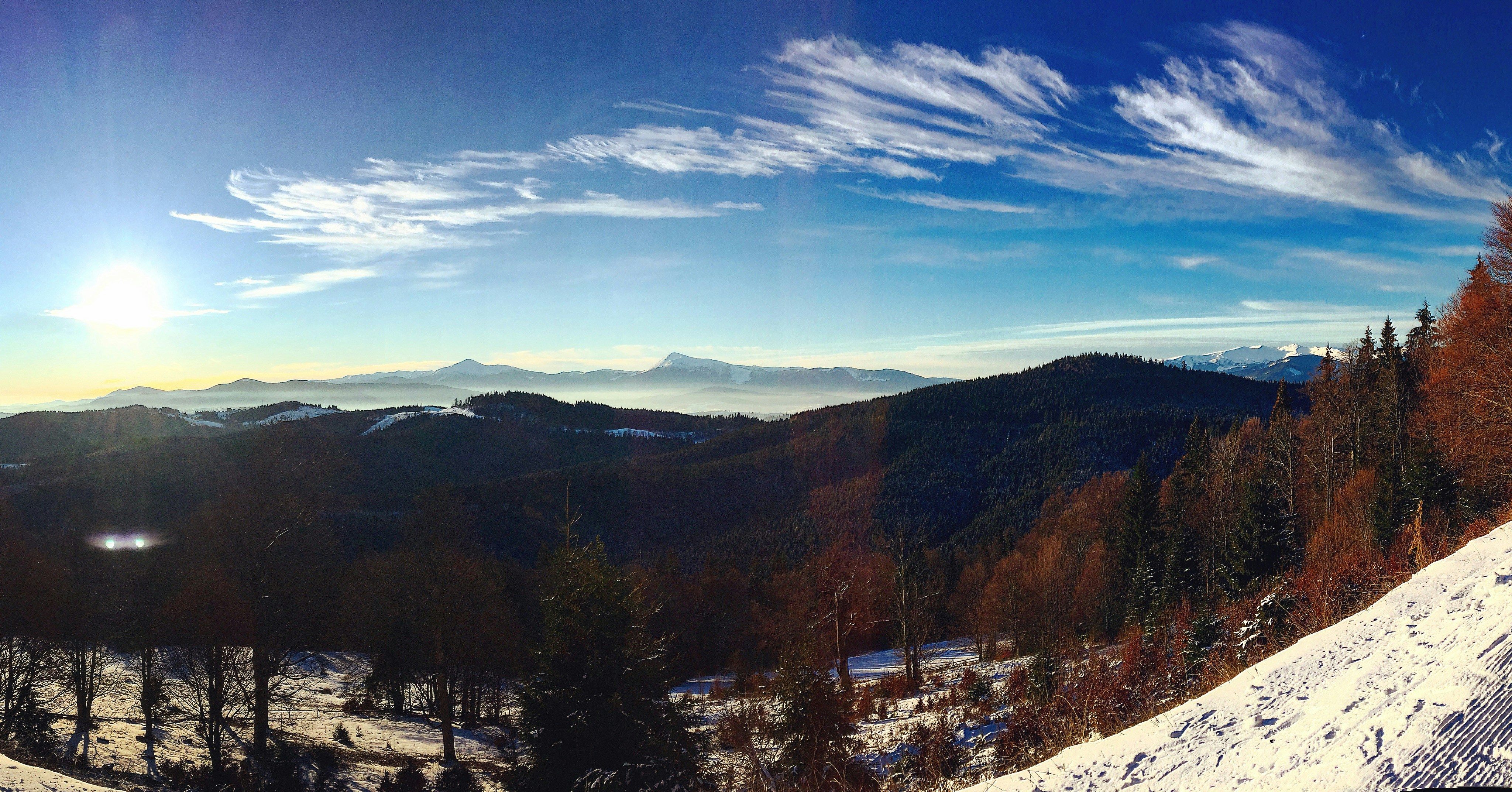 Panoramic winter landscape of Gulmarg with fresh snow and clear blue sky
