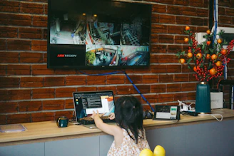 a woman standing in front of a television