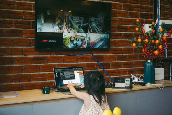 a woman standing in front of a television