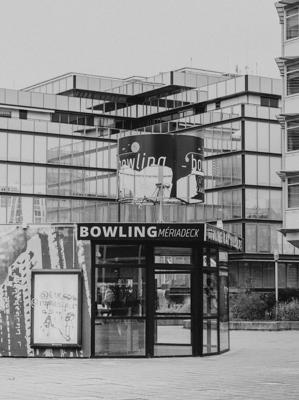 a black and white photo of a bowling shop