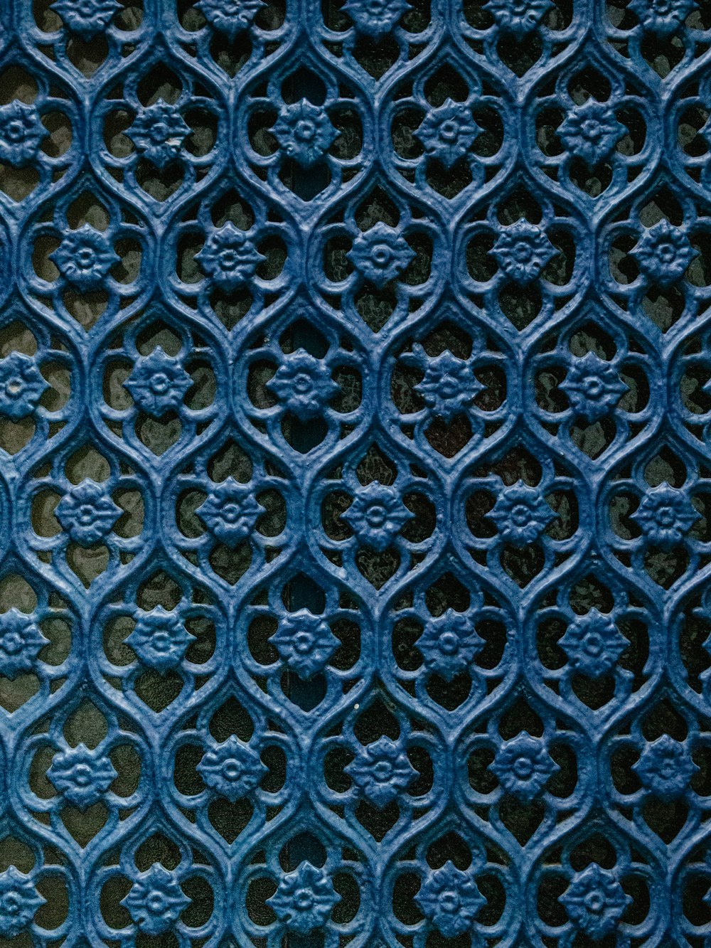 a close up of a blue metal surface