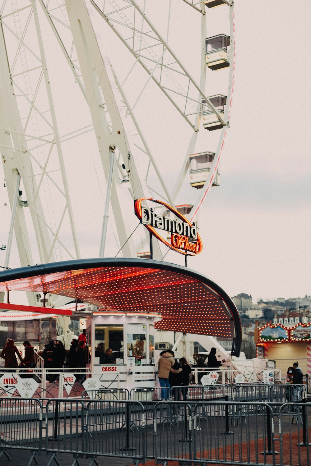 a large ferris wheel sitting next to a building