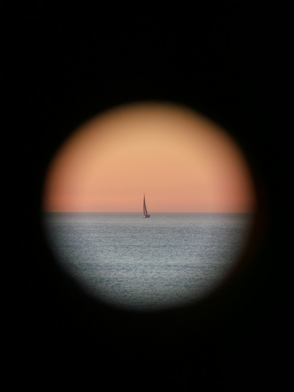 a view of a sailboat out in the ocean