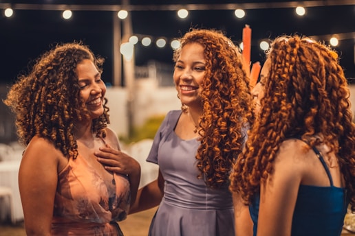 a group of women standing next to each other