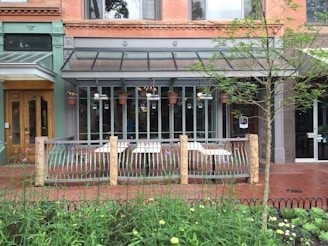 A charming brick storefront in a bustling commercial district.