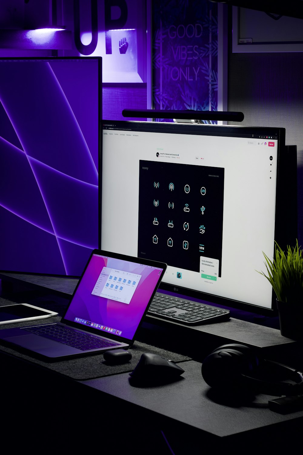 a laptop computer sitting on top of a desk