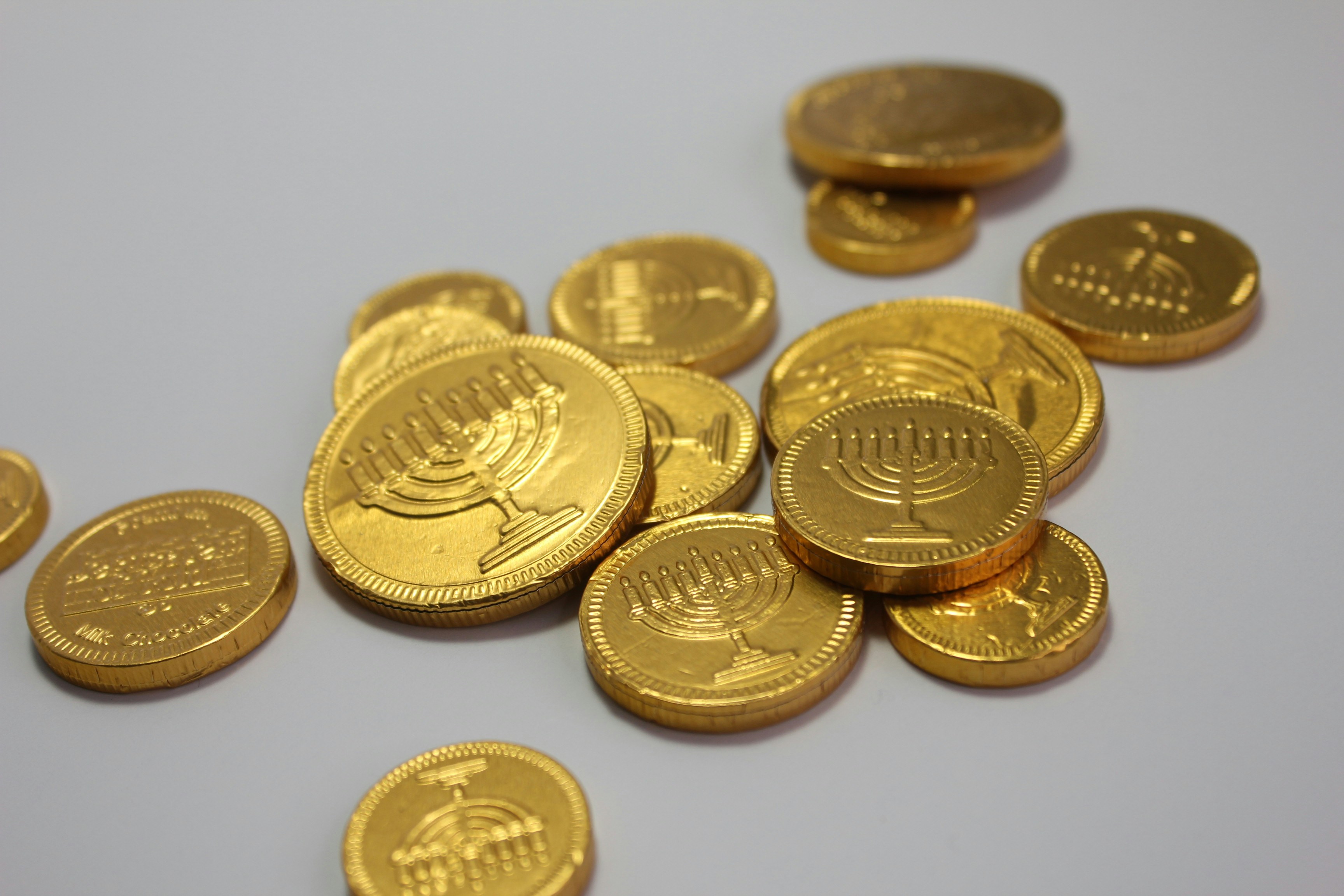 Festive Chanukah Gelt Chocolate Coins On White Background To Celebrate The Holiday Season