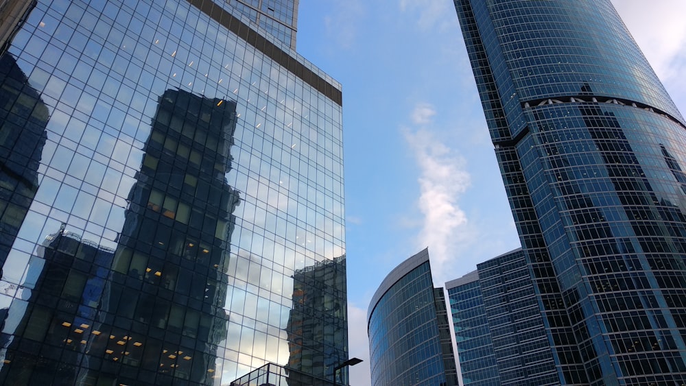 a couple of tall buildings sitting next to each other