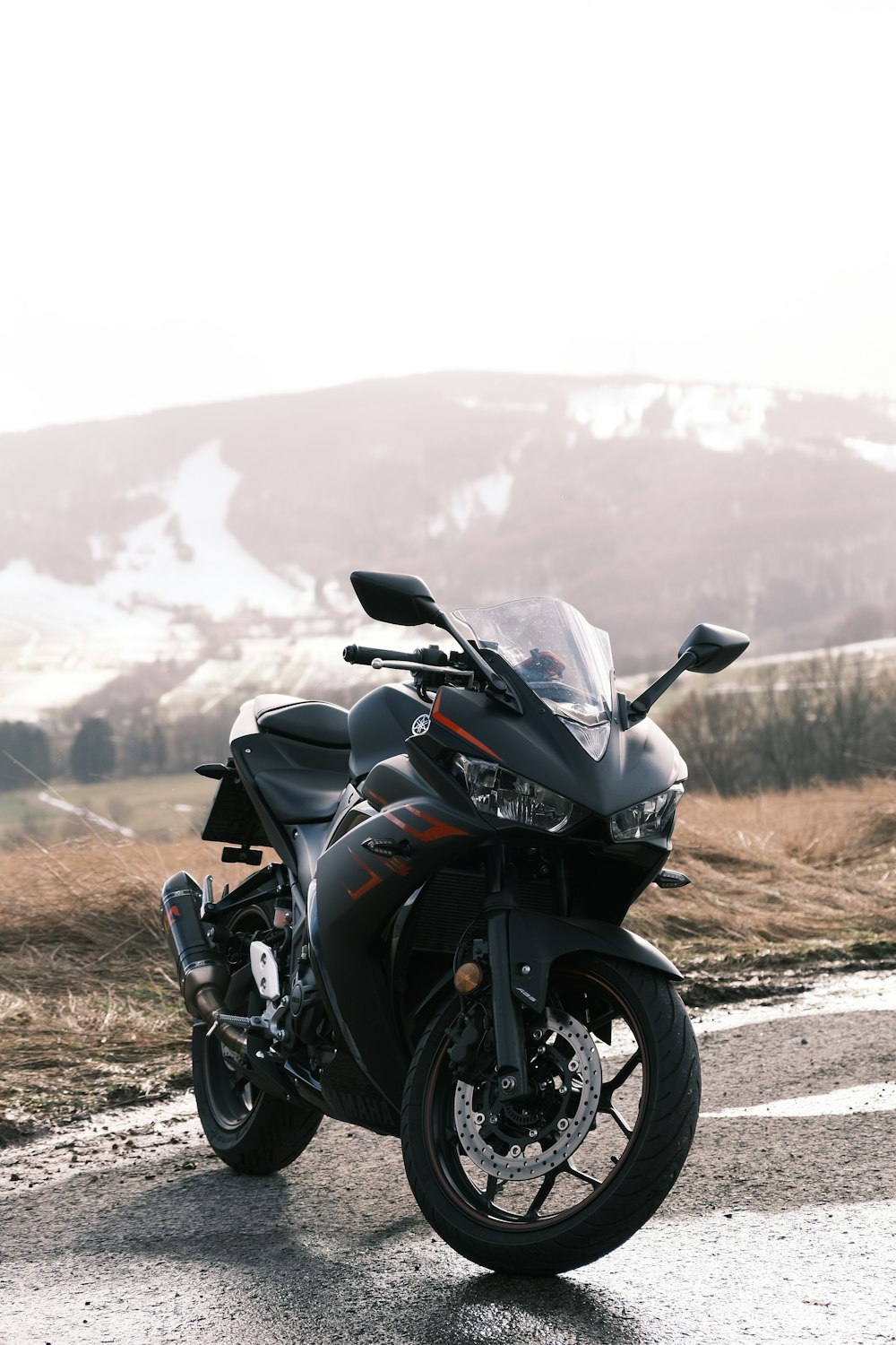 a motorcycle parked on the side of the road