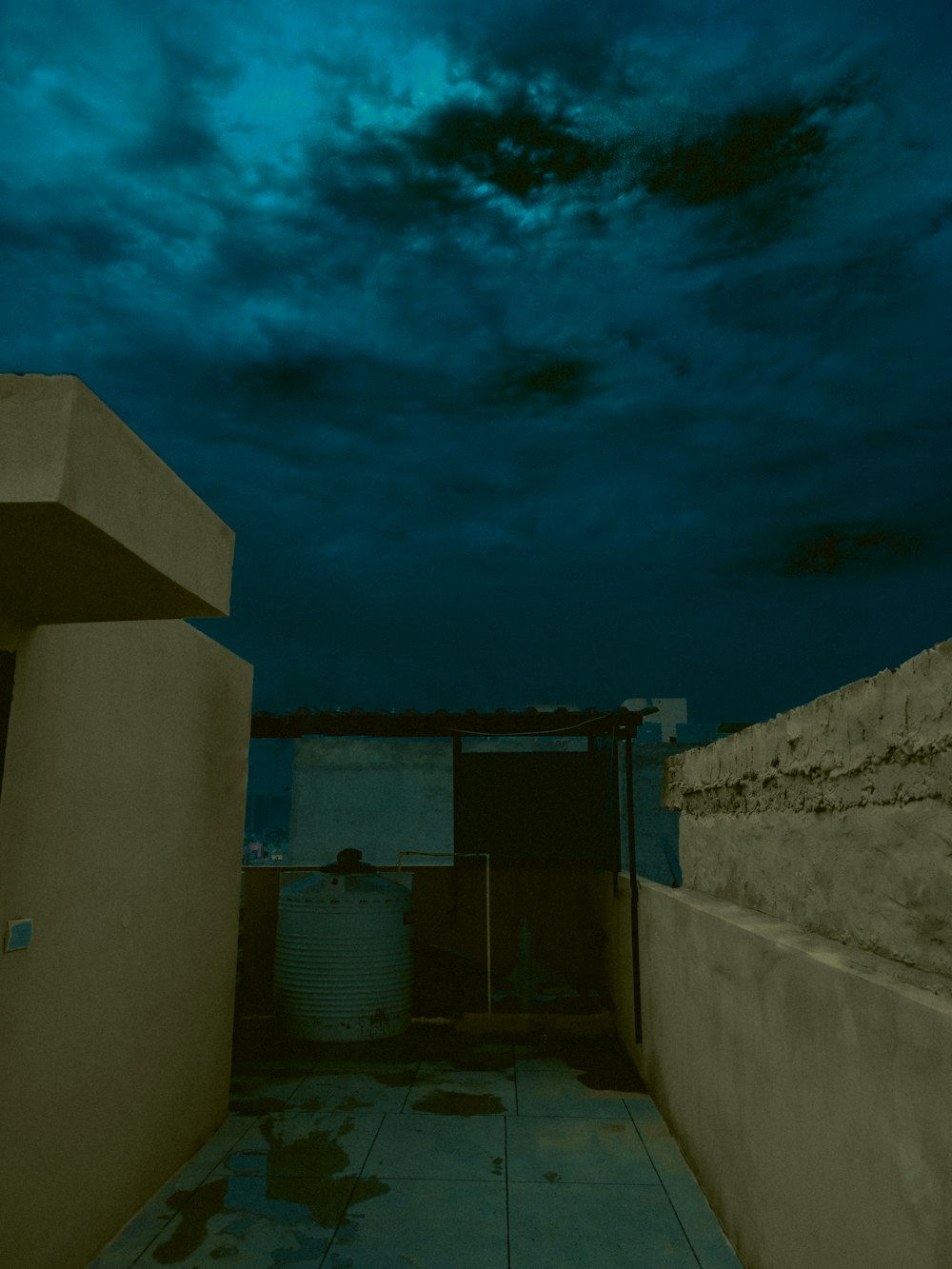 a view of the sky from a rooftop at night