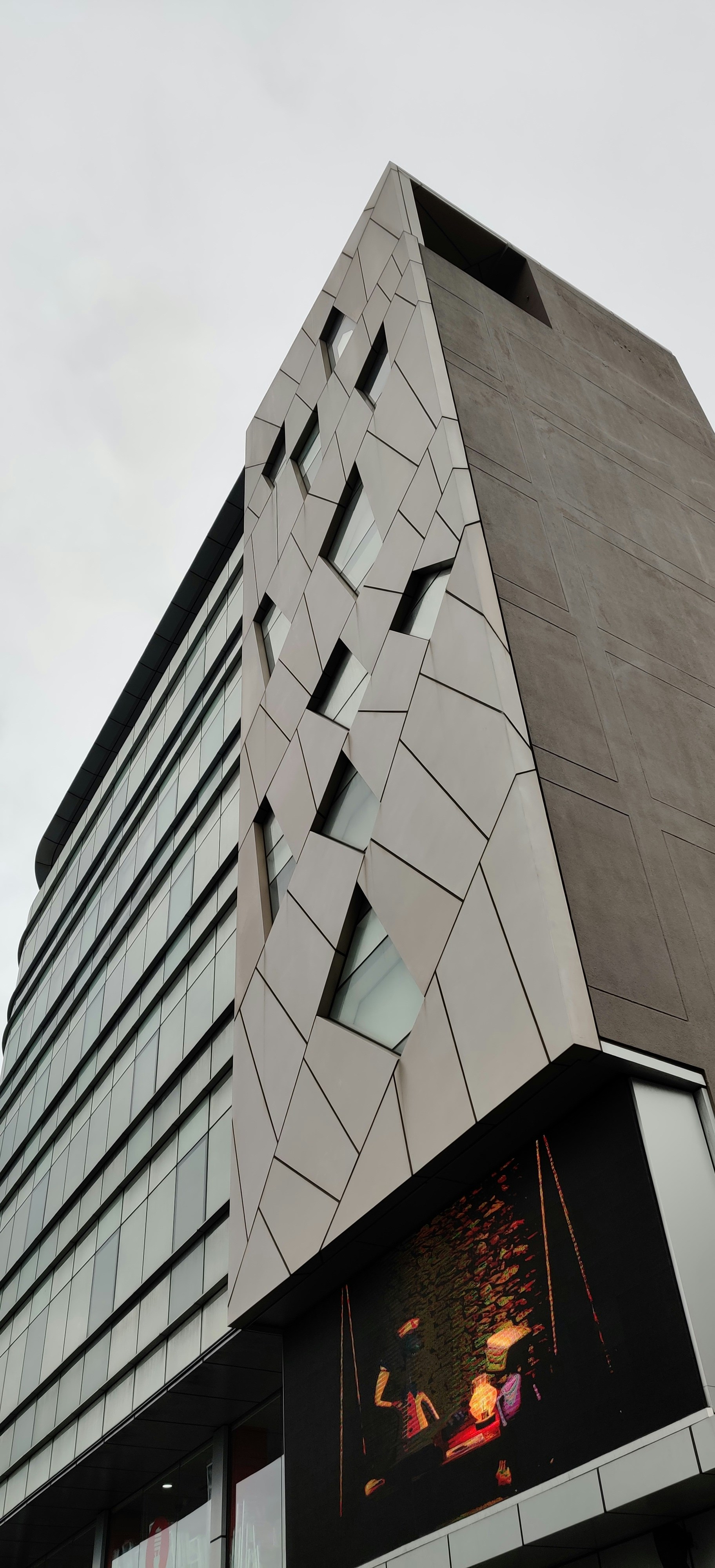 a tall building with a large window on the side of it