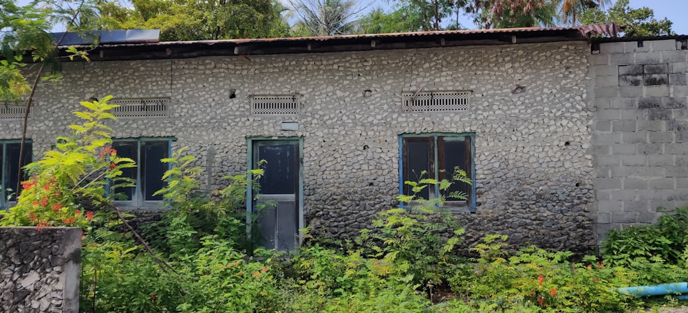 a building made out of rocks with windows