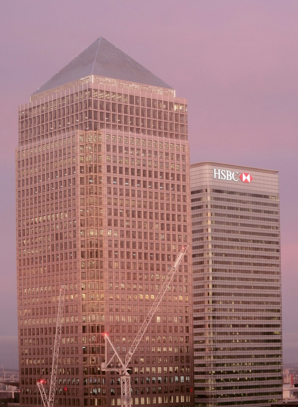 a very tall building with a crane in front of it