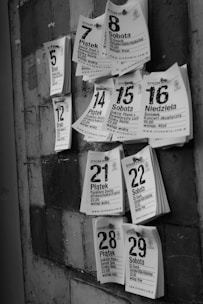 a bunch of flyers are hanging on a wall