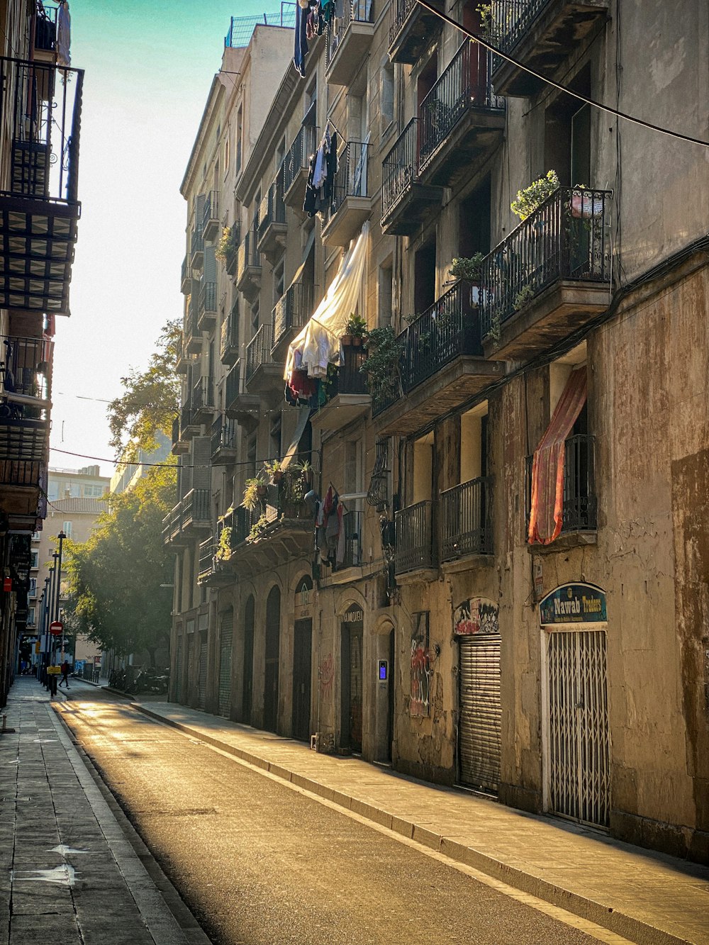 a city street with buildings and balconies with balconies on the bal