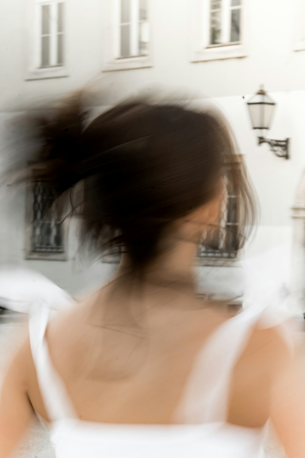 a blurry photo of a woman in a white dress