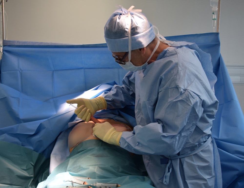 a person in a hospital gown operating a machine