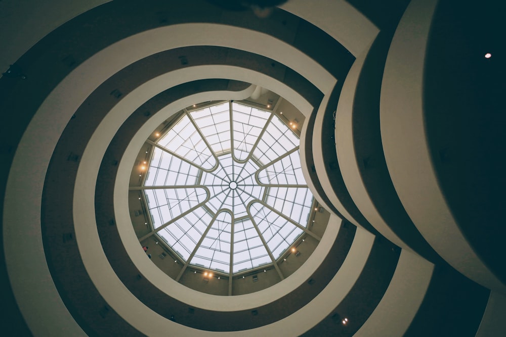 a circular window in a building with a skylight