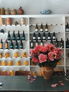 A vibrant display of household items on a wooden shelf.