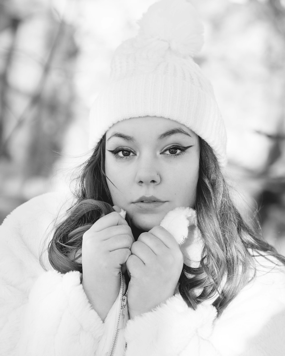 a woman in a white coat and a white hat