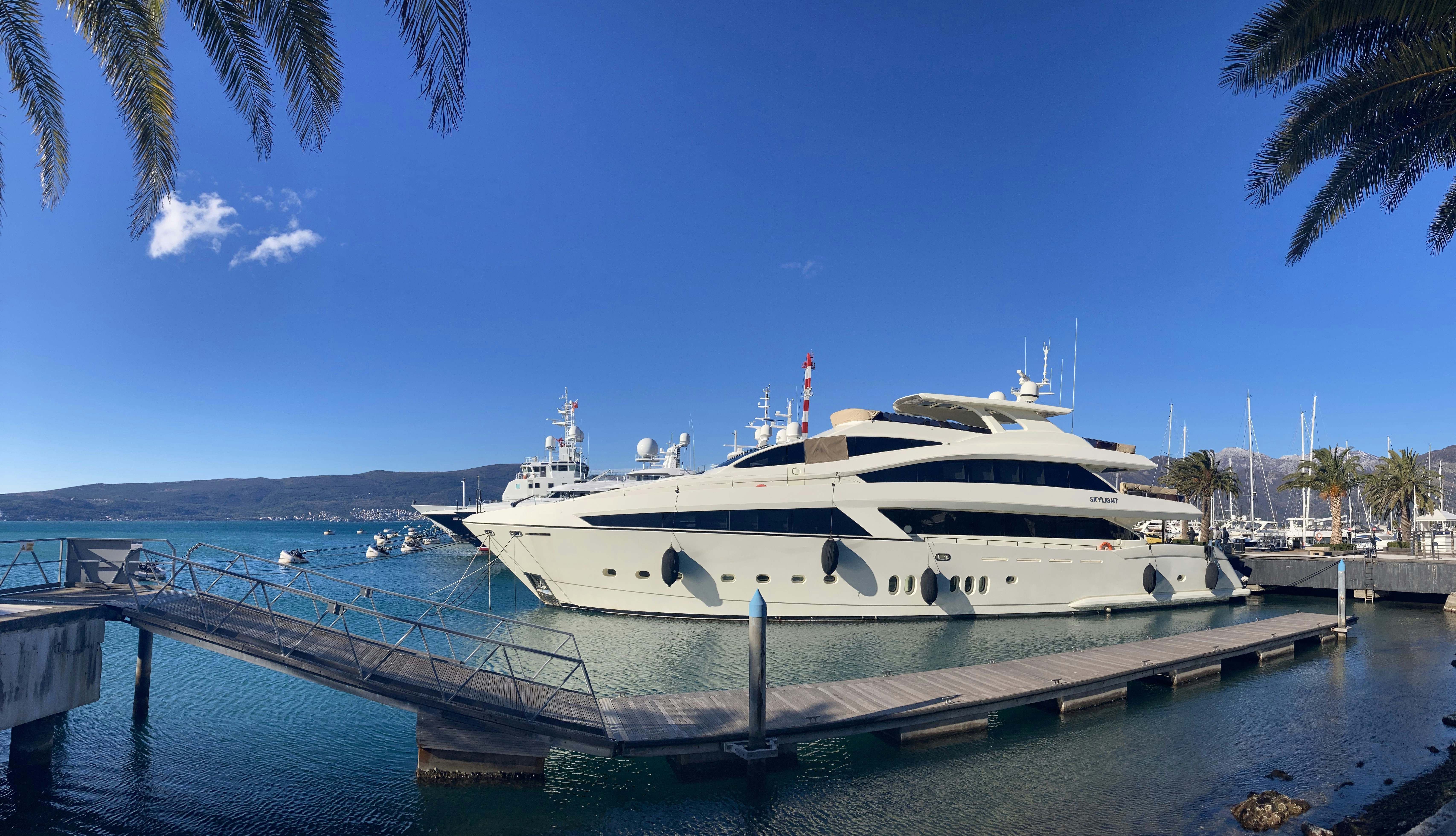a large white boat docked at a dock