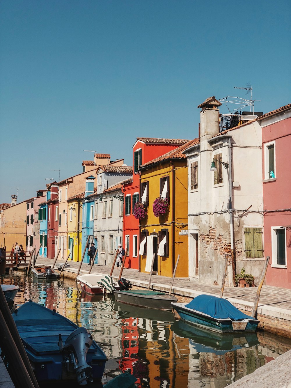 a row of houses next to a body of water