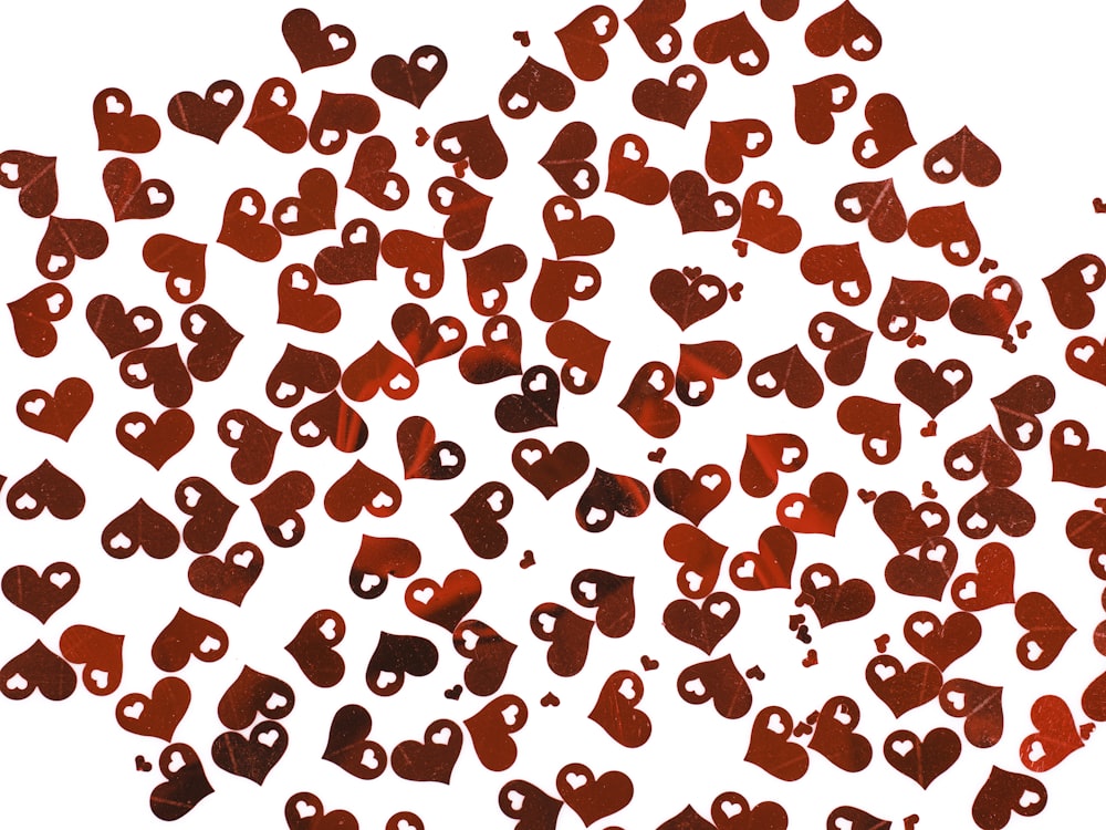 a bunch of red hearts on a white background