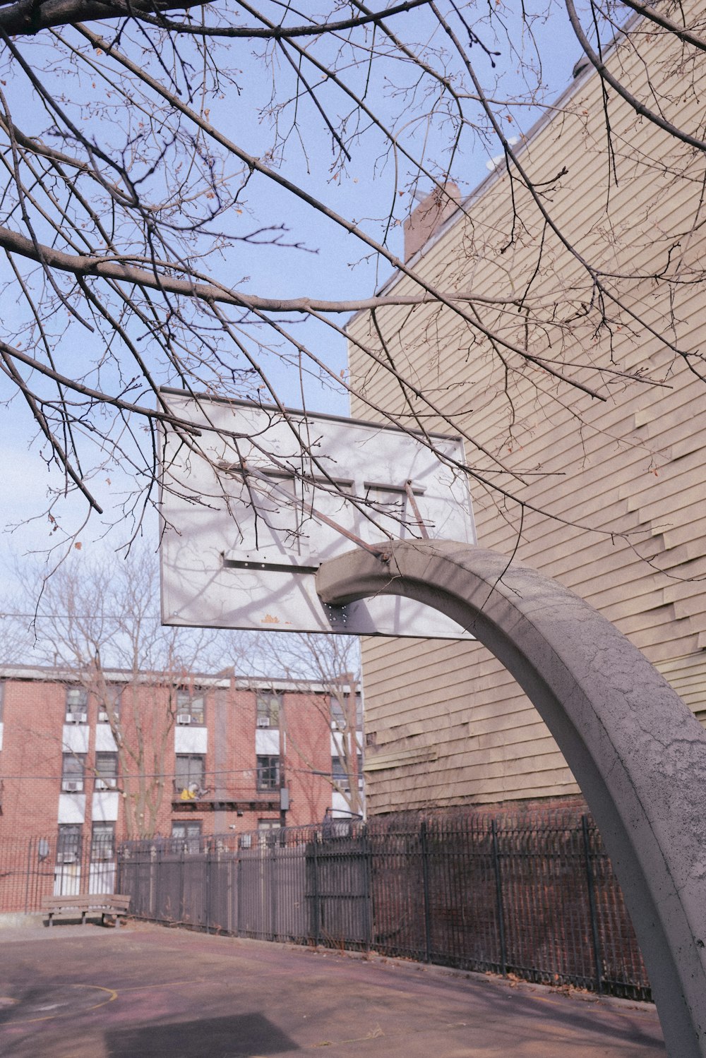 a basketball hoop in front of a brick building