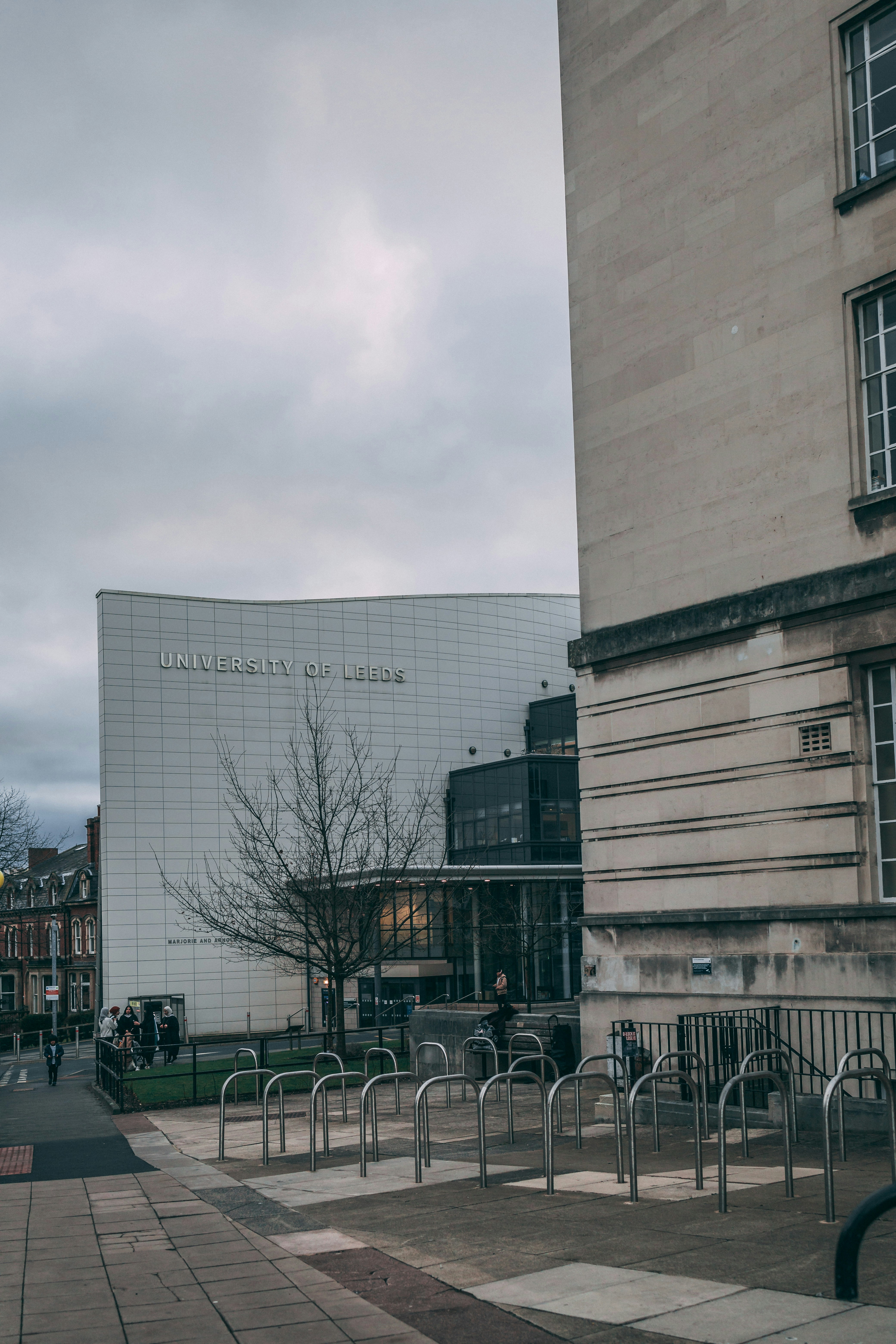 A building that has a bunch of chairs in front of it photo – Free ...