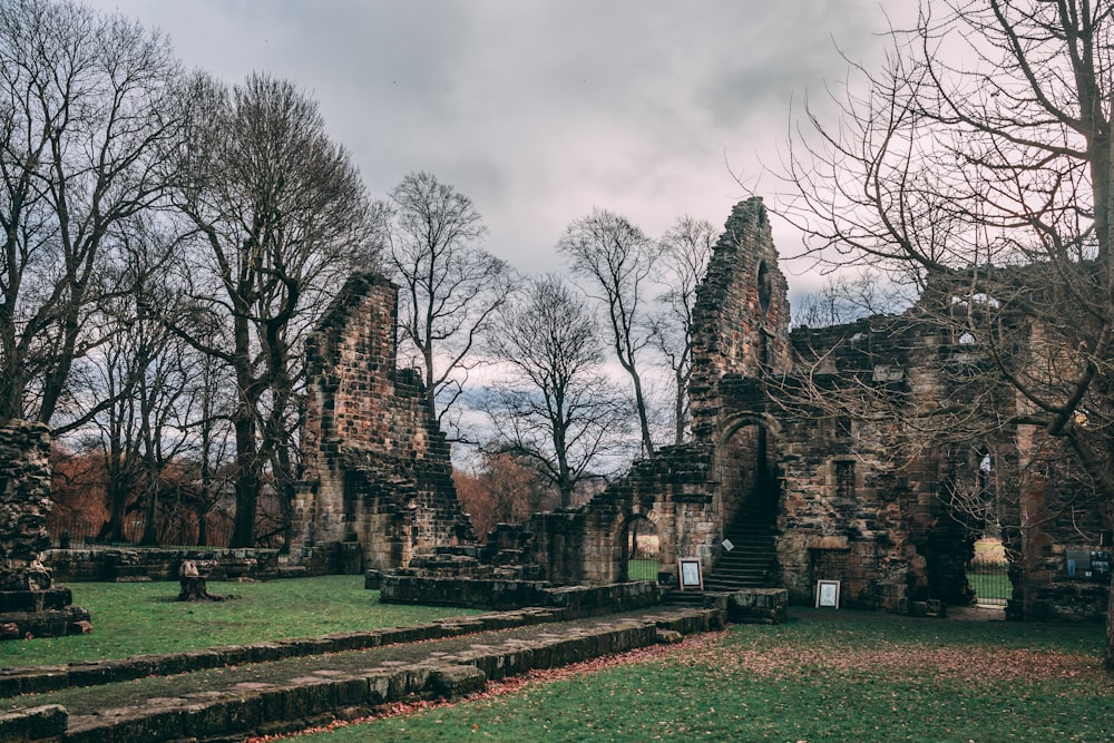 the ruins of an old church in the woods