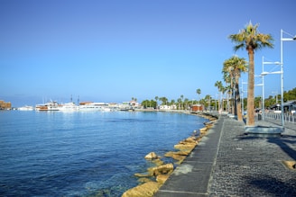 a large body of water with a boat in the distance