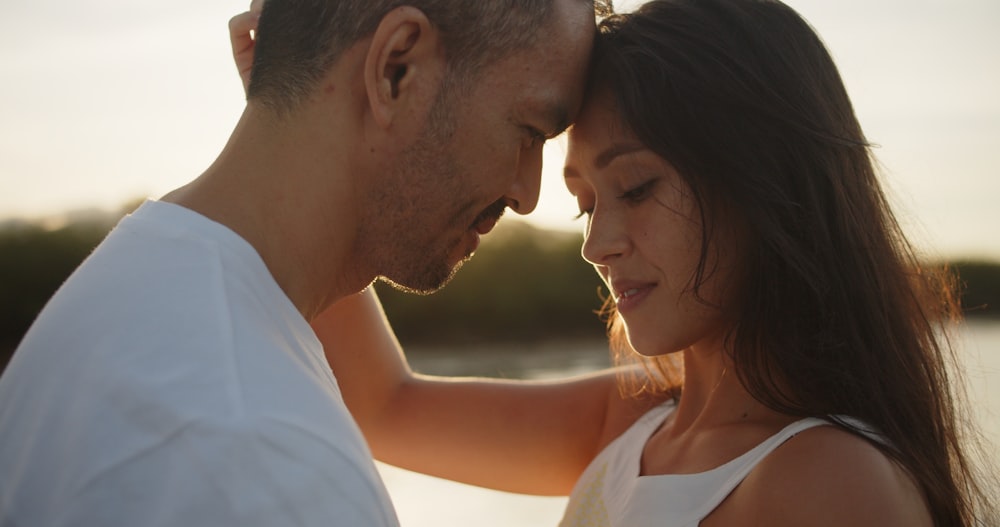 a man and a woman standing next to each other