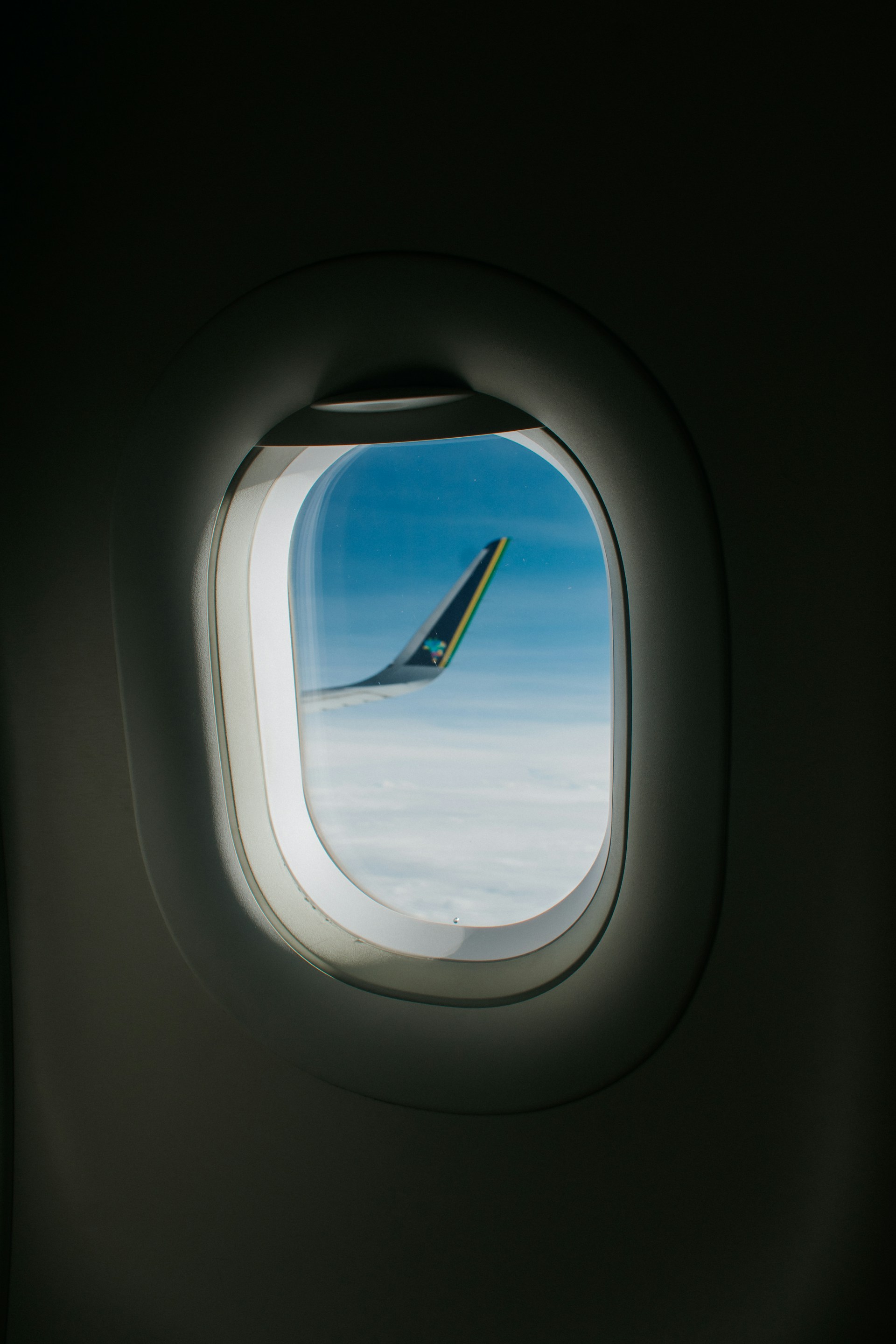 a view of the wing of an airplane through a window