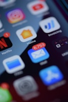 a close up of a cell phone with various app icons