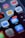 A smartphone screen displays multiple app icons, including Netflix, Instagram, Home, and Invoicing. The email app shows a notification bubble with 6,753 unread messages, and there is a red notification dot on the Netflix app.