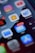 A smartphone screen displays multiple app icons, including Netflix, Instagram, Home, and Invoicing. The email app shows a notification bubble with 6,753 unread messages, and there is a red notification dot on the Netflix app.