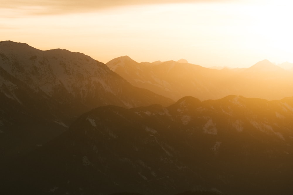 a view of a mountain range at sunset