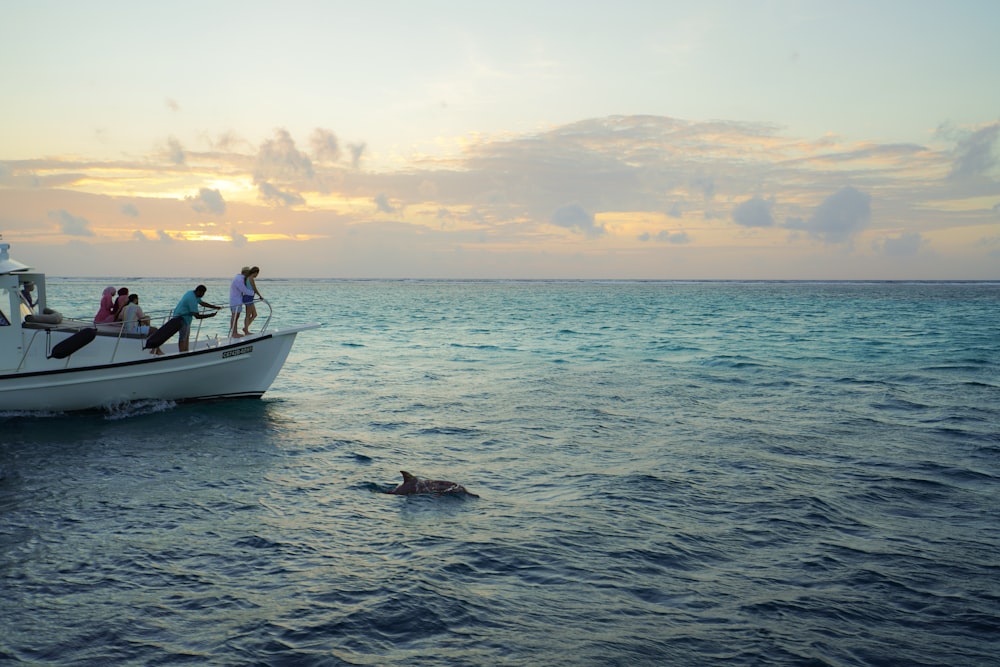 a group of people riding on the back of a boat